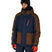 MNightlineInsulatedJacket-Person wearing a brown and navy jacket with red accents on a white background