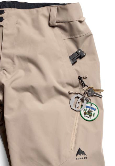 MReserve2LRelaxedPants-Beige pants with a brand logo on a white background