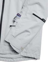 MReserveGORE-TEX2LInsulatedJacket-Light gray jacket with black zippers on a white background