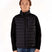 MSawyerPuffyVest-Man wearing a black puffer vest over a black shirt on a white background