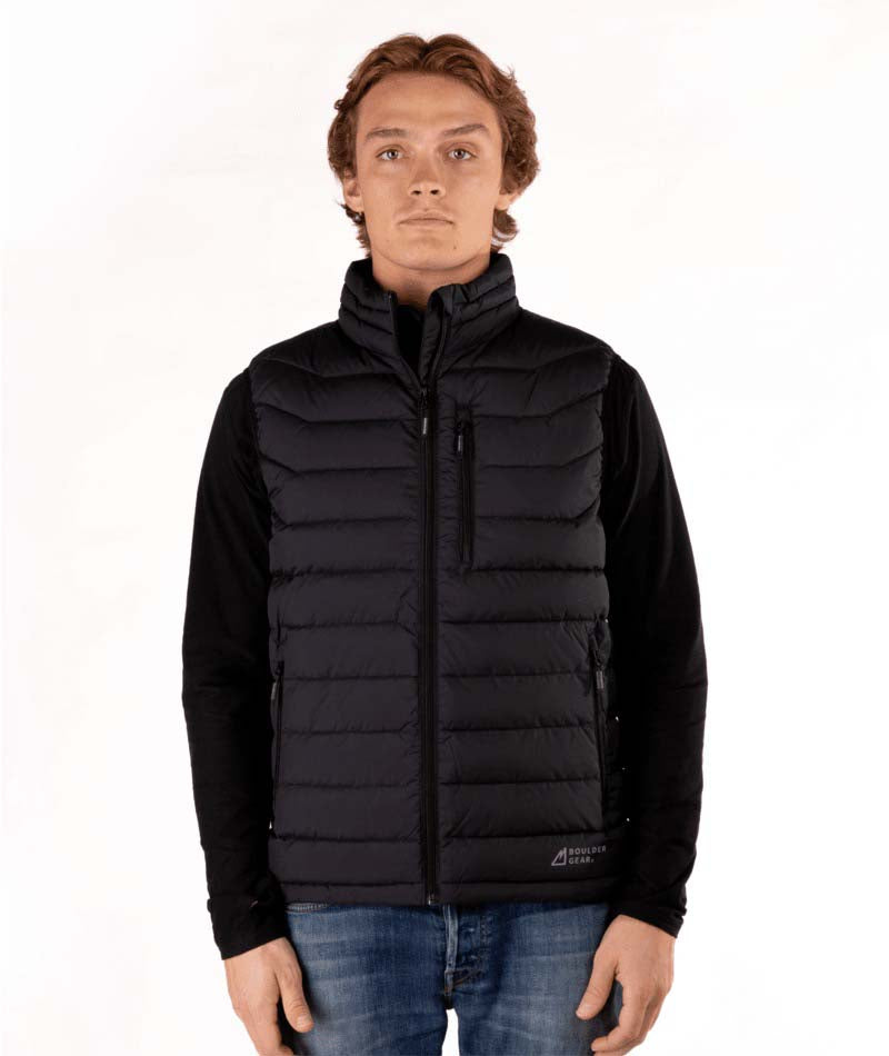 MSawyerPuffyVest-Man wearing a black puffer vest over a black shirt on a white background
