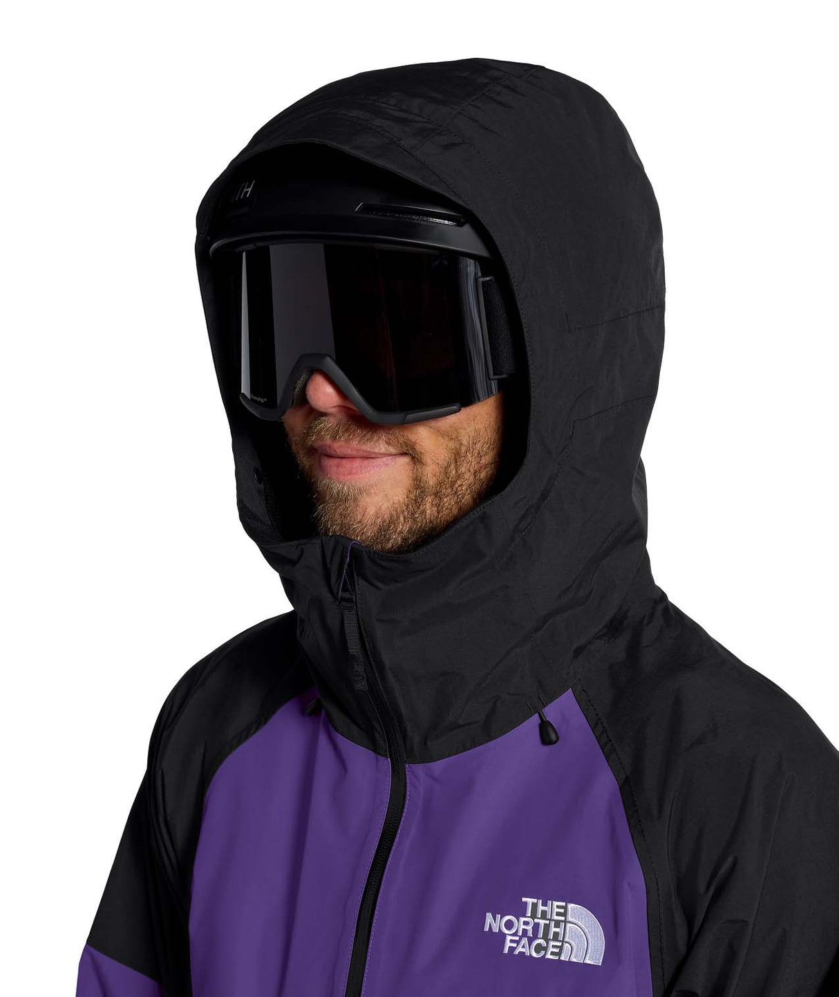 MSliderJacket-Man wearing a purple and black jacket with The North Face logo on a white background