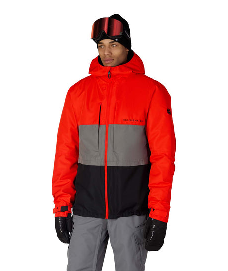MSmarty3-in-1FormJacket-Person wearing a red, gray, and black jacket with goggles on a white background