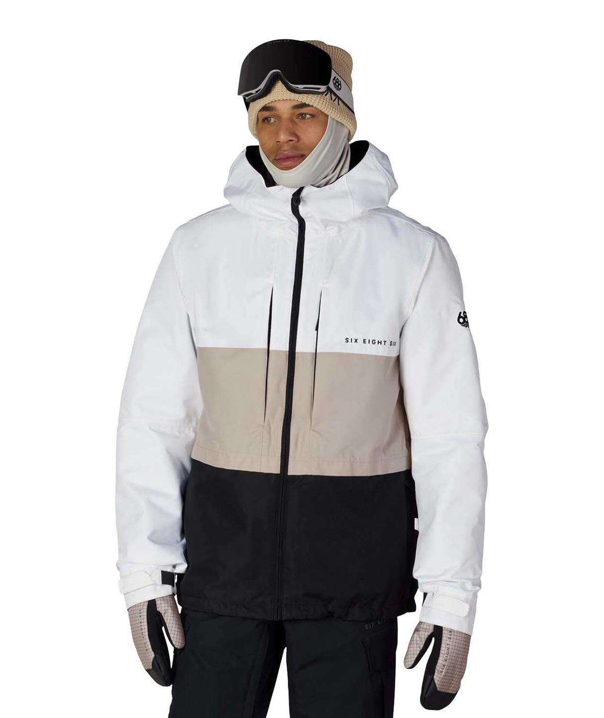 MSmarty3-in-1FormJacket-Person wearing a white and beige ski jacket with black pants on a white background