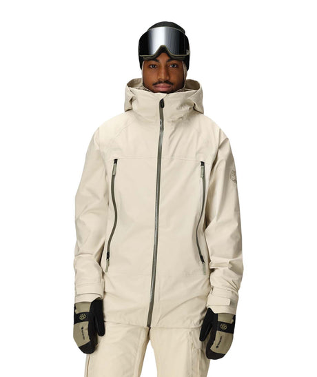 MSmarty3-in-1Rodeo3LJacket-Person wearing a beige ski suit with goggles on a white background