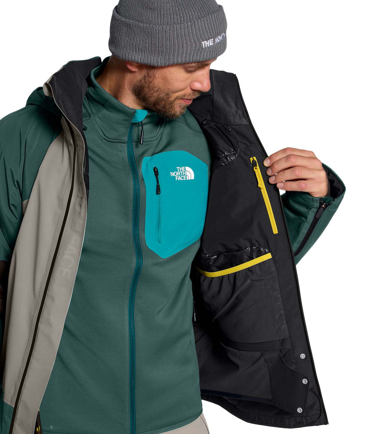 MSnowsquallJacket-Green and gray jacket with The North Face logo on a white background