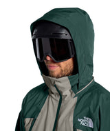 MSnowsquallJacket-Green and gray jacket with The North Face logo on a white background