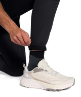 MSummitFUTUREFLEECEPant-Person wearing black jogger pants with a brand logo on a white background