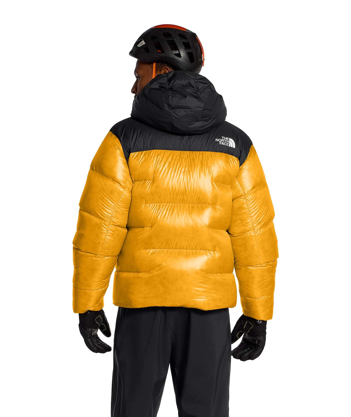 MSummitNuptseJacket-Yellow and black puffer jacket with The North Face logo on a white background