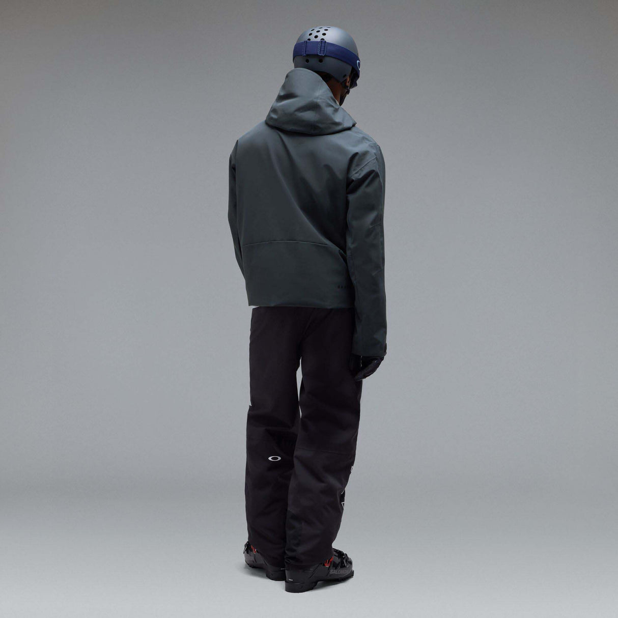 MTimberlineShellAnorak-A dark gray hooded jacket with a large tonal Oakley logo on the chest, displayed against a neutral gray background.
