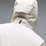 MTimberlineShellAnorak-An off-white hooded anorak jacket with a large black Oakley logo on the chest, displayed against a neutral gray gradient background.