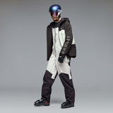 MTimberlineShellBib-A white and black technical snow bib with adjustable shoulder straps, a front zipper, and reinforced lower leg panels, shown against a neutral gray gradient background.
