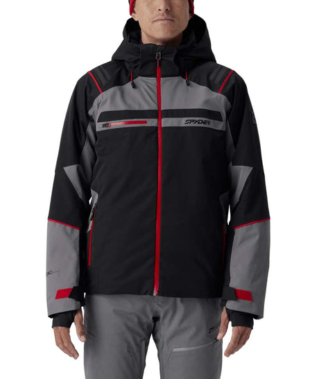MTitanJacket- Man wearing a black, red, and grey ski jacket on a white background
