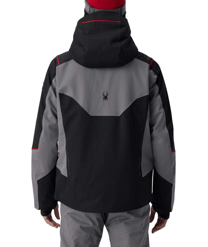 MTitanJacket- Man wearing a black, red, and grey ski jacket on a white background
