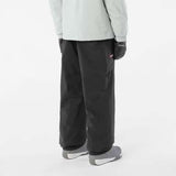 MVenomShellPant-Person wearing black pants and a light gray jacket on a white background