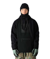 MWaterproofHoody-A model wearing a black hooded jacket with a high neck, black beanie, black gloves, and camouflage pants, shown against a plain white background.