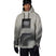 MWaterproofHoody-A man modeling a light gray and black 686 hooded snow jacket with a black chest logo, black pants, black gloves, and a black beanie with goggles, set against a plain white background.