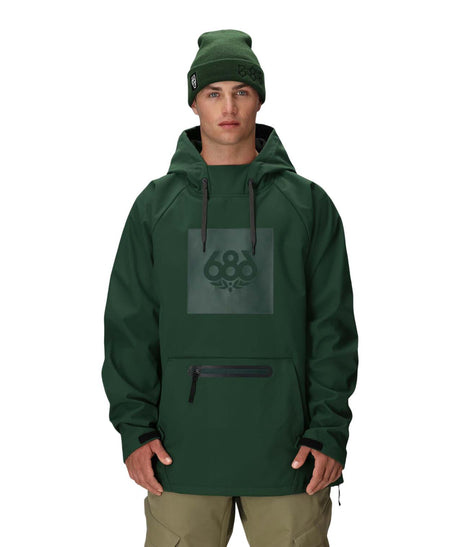 MWaterproofHoody-A man wearing a dark green hooded snowboard jacket with a tonal green 688 logo on the chest, paired with a matching green beanie and khaki pants, against a plain white background.