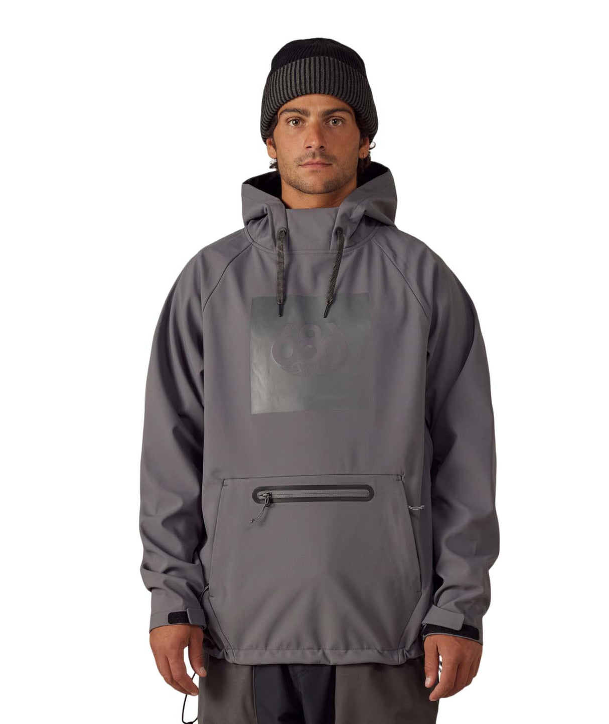 MWaterproofHoody-A man wearing a gray hooded jacket with a tonal chest logo, a front zippered pocket, and a black beanie, photographed against a plain white background.