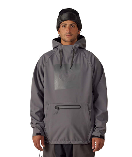 MWaterproofHoody-A man wearing a gray hooded jacket with a tonal chest logo, a front zippered pocket, and a black beanie, photographed against a plain white background.