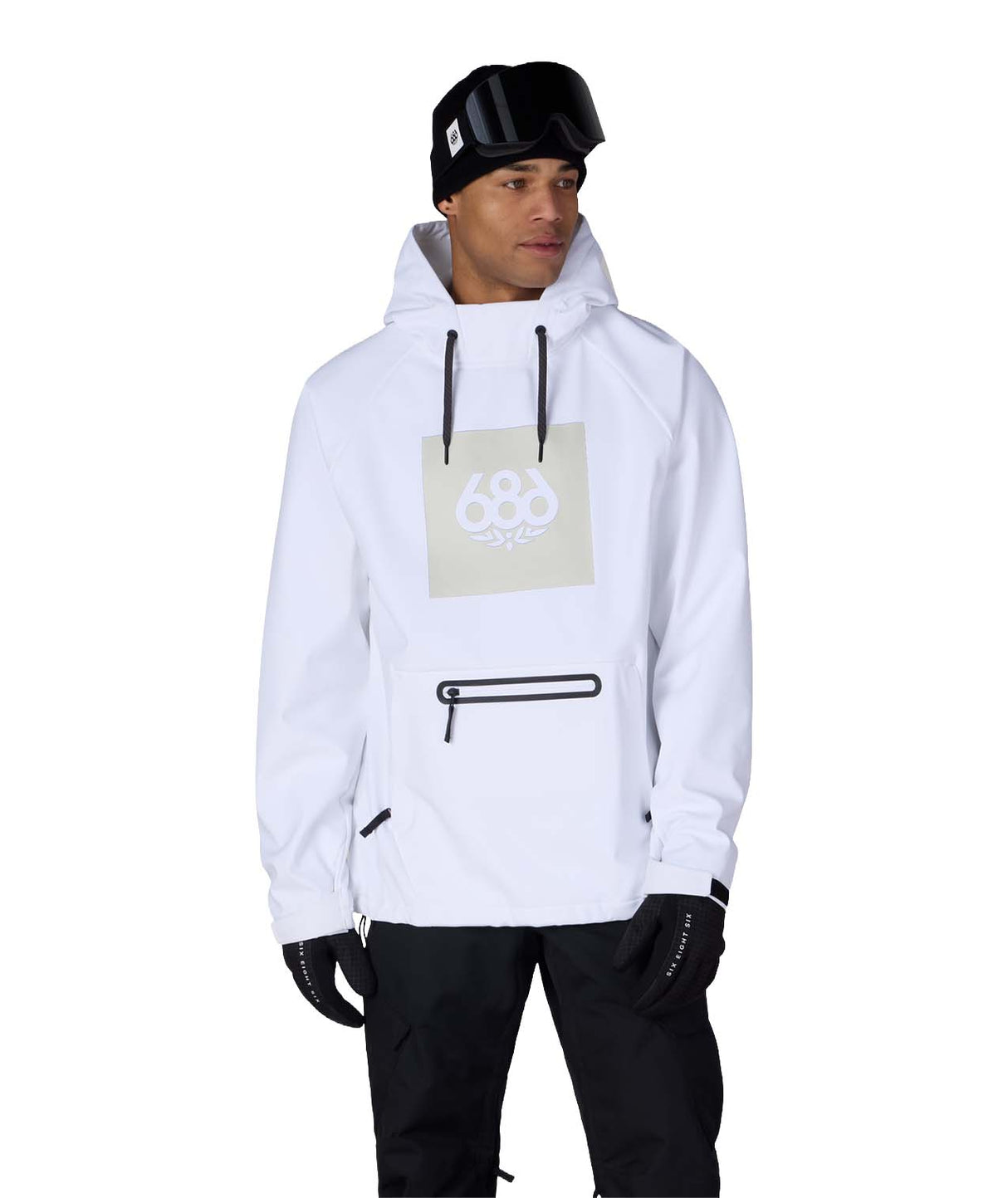 MWaterproofHoody-A man wearing a white hooded snowboard jacket with a beige square chest graphic, black drawstrings, and a black zipper pocket, paired with black pants, gloves, and a black beanie with goggles, against a plain white background.