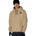MWaterproofTeamHoody-Person wearing a beige hoodie with a logo, black beanie, and gloves on a white background