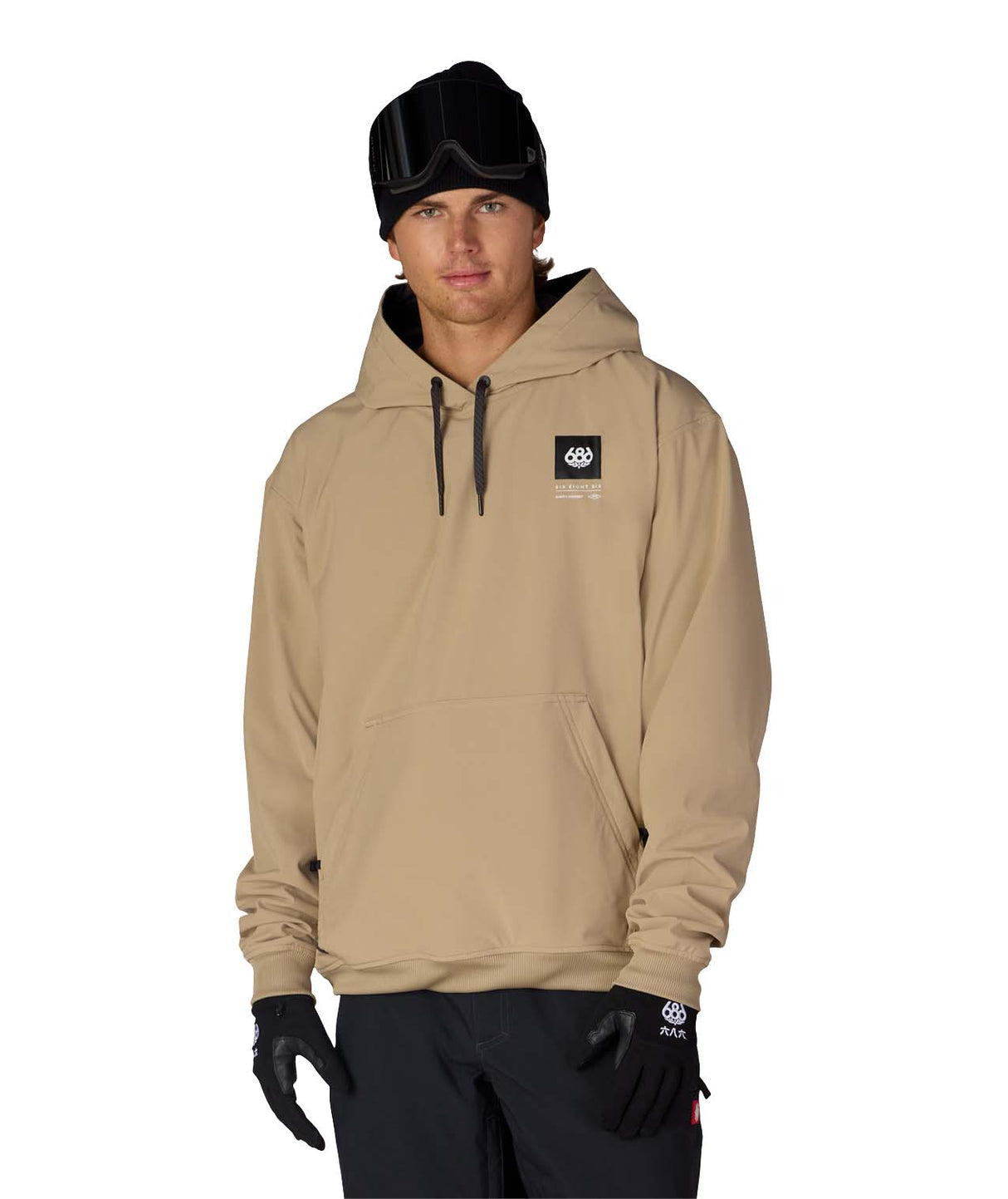 MWaterproofTeamHoody-Person wearing a beige hoodie with a logo, black beanie, and gloves on a white background