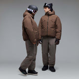 MWintertideSoftshellPant-A pair of gray snow pants with a black belt and a small black Oakley logo on the left thigh, displayed against a neutral gray gradient background.