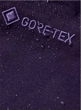 M_ak_CyclicGORE-TEX2LBibPants-Purple snow pants with suspenders on a white background