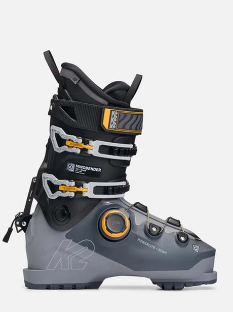 Mindbender100BOA- A K2 Mindbender ski boot in gray and black with yellow accents, shown from a side profile on a light gray background.