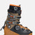 Mindbender140BOA- Brown and black ski boot with orange accents on a white background