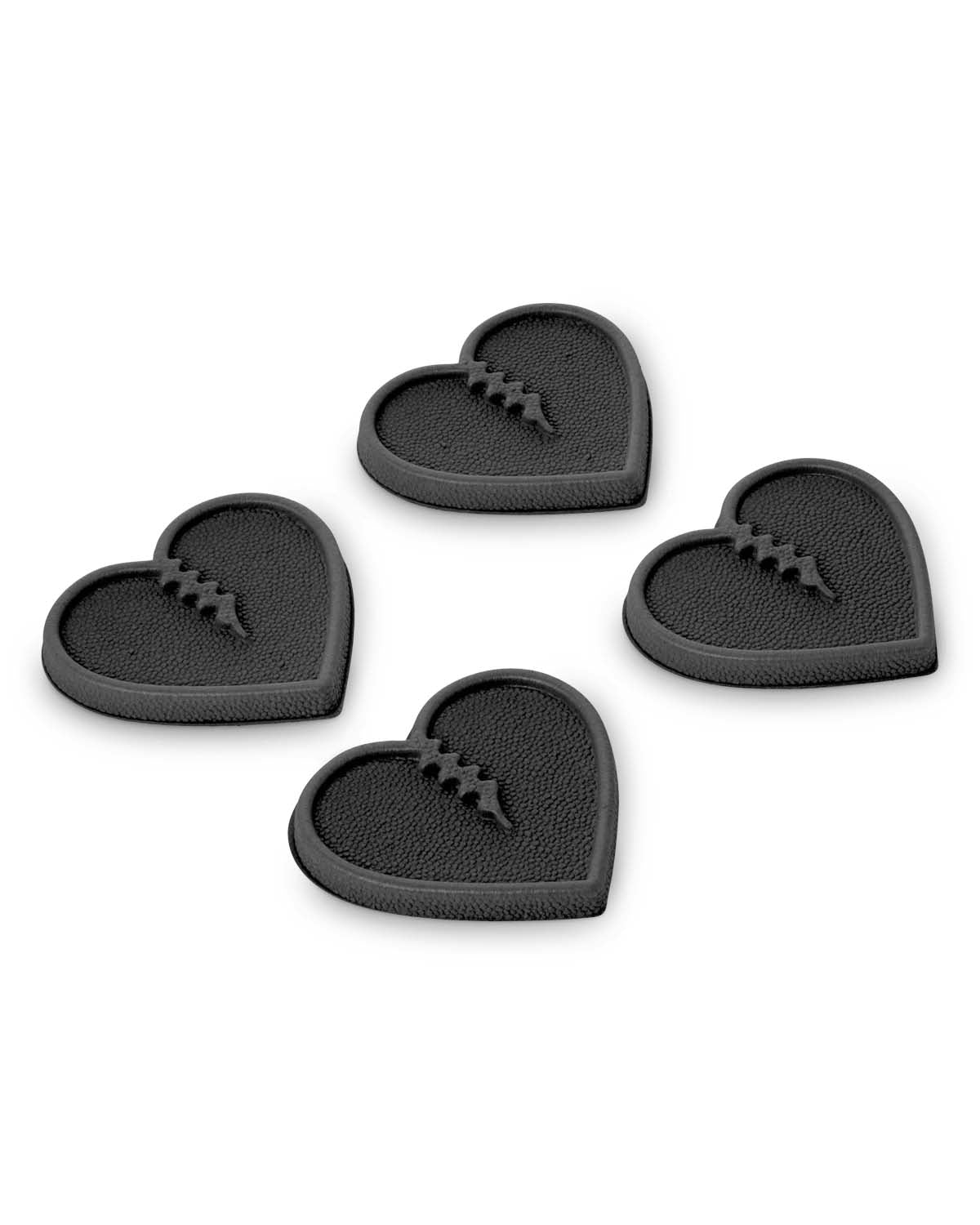 MiniHearts-Four black heart-shaped stomp pads on a white background