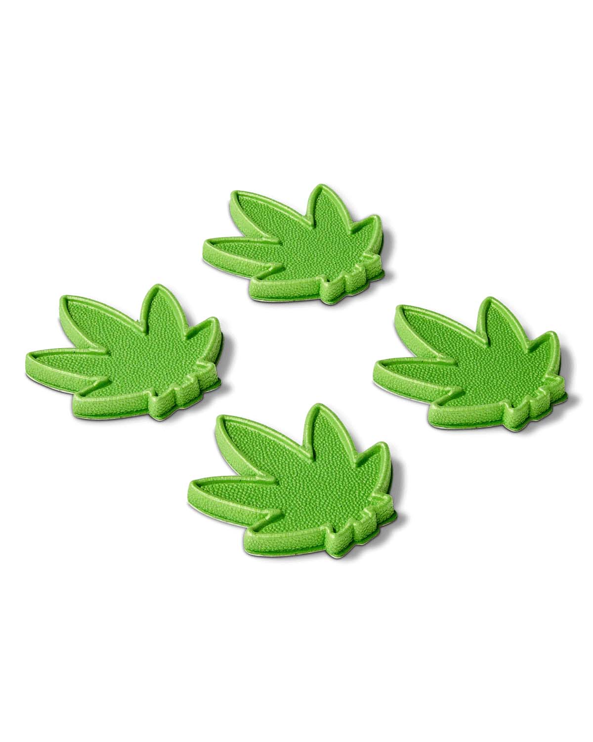 MiniSeaweed- Four green cannabis leaf-shaped stomp pads on a white background