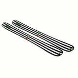 NDEPART01-Two black and white striped skis with green bindings on a white background