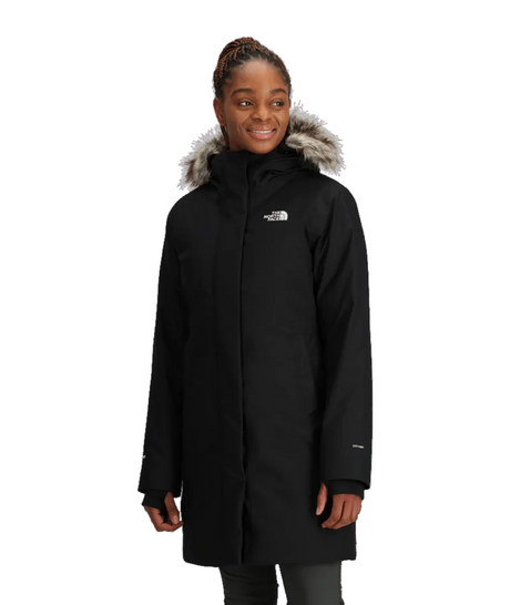 W Arctic Parka-Person wearing a black coat with fur-lined hood on a transparent background