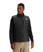 M Terra Peak Vest- Man wearing a black puffer vest with a visible brand logo on a white background