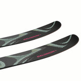 NQST100-Two skis with green and black design and Salomon branding on a white background