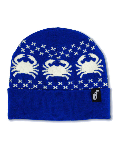 NordicrabBeanie- A royal blue knit beanie hat featuring three white knitted crabs and small white X patterns, with a folded cuff and a small black brand tag on the side.