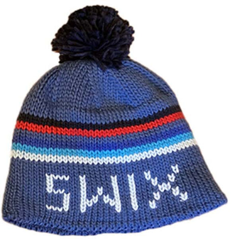 OleHat- A blue knit beanie hat with a black pom-pom on top, featuring horizontal stripes in red, black, light blue, and white, with white lettering reading 'SWIX' on the front.
