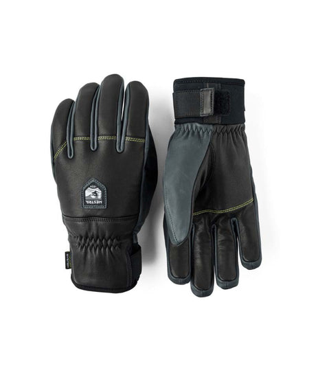 OmniTriggerGlove-A pair of black leather winter gloves shown against a plain white background, displaying both the back of one glove with a brand patch and the front of the other glove.