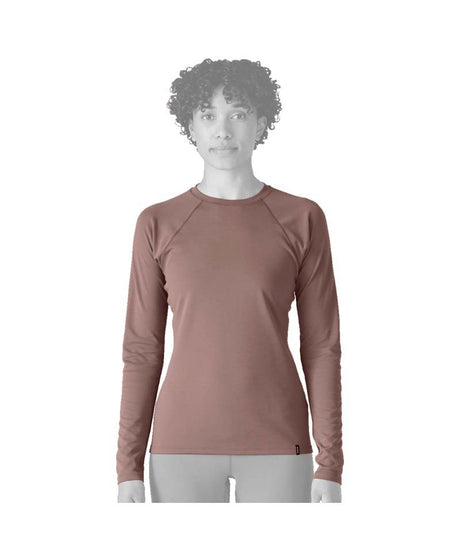 Patagonia Capilene Midweight Womens Crew- Person wearing a light pink long-sleeve shirt on a white background