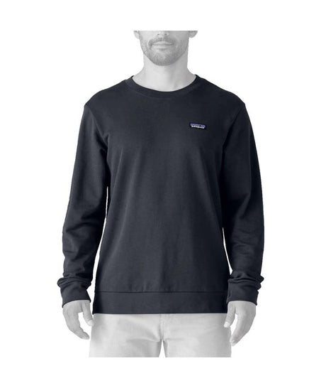 Patagonia Daily Mens Crew- Person wearing a black sweatshirt with a logo on a white background