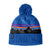Patagonia Powder Town Kids Beanie- Blue knit beanie with mountain design and pom-pom on a white background, Shop at Aspen Ski and Board Columbus Ohio