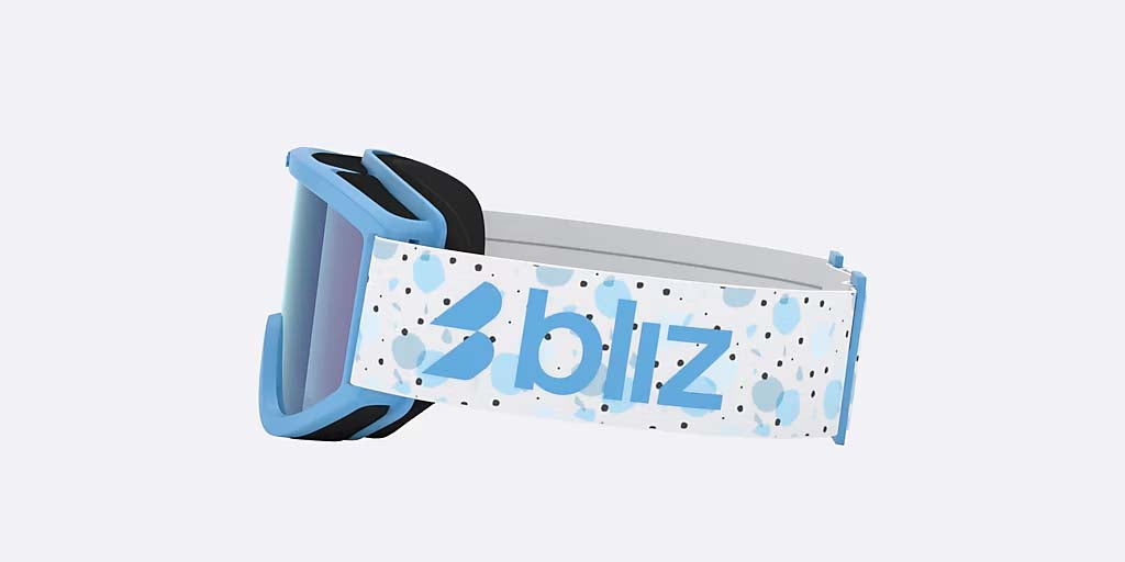 Pixie-Bliz ski goggles in matte blue with a mirrored blue lens and a matching blue strap, shown on a light gray background.