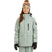 RumbleJacket- A smiling girl wearing a light sage green snowboard jacket, matching snow pants, black gloves, and a knit beanie with ski goggles, standing against a plain white background.