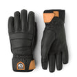 Pair of black gloves with orange accents on a white background