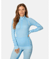 Smekker1_2ZipBaseLayer-Light blue sweater with intricate patterns on a white background