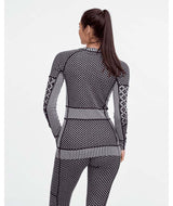 SmekkerLongSleeveBaseLayer-Black and white patterned sweater on a white background