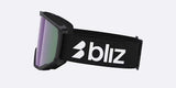 Spark-Bliz ski goggles in matte black with a mirrored purple lens and a matching black strap, shown on a light gray background.