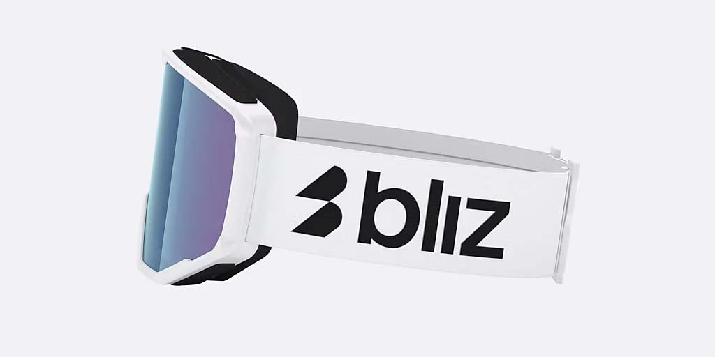 Spark-Bliz ski goggles in matte white with a mirrored blue lens and a matching white strap, shown on a light gray background.